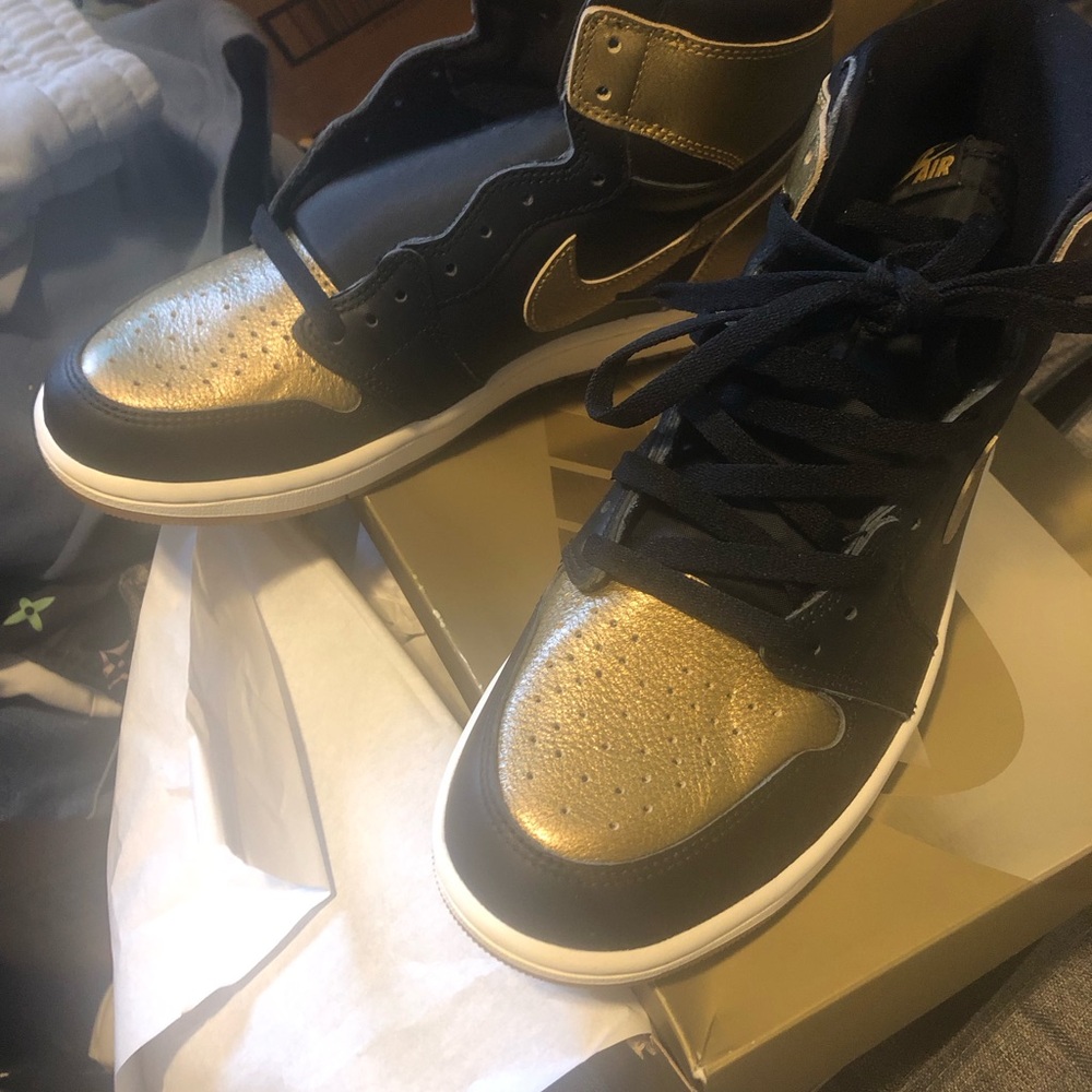 Nike Air Jordan 1 Low Black and Metallic Gold Sneakers